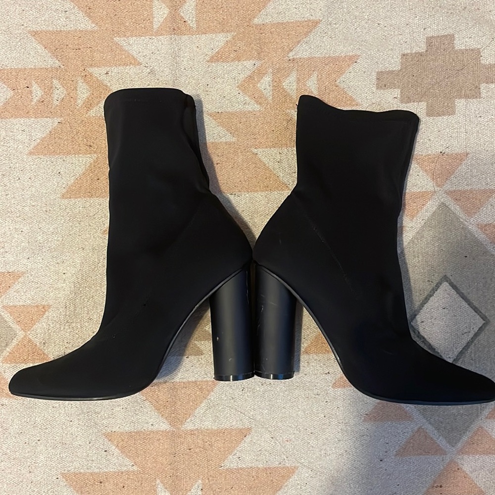 Skintight black ankle booties